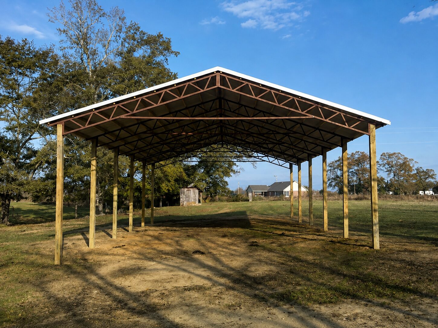 Open-sided pole barn equipment cover with wood posts